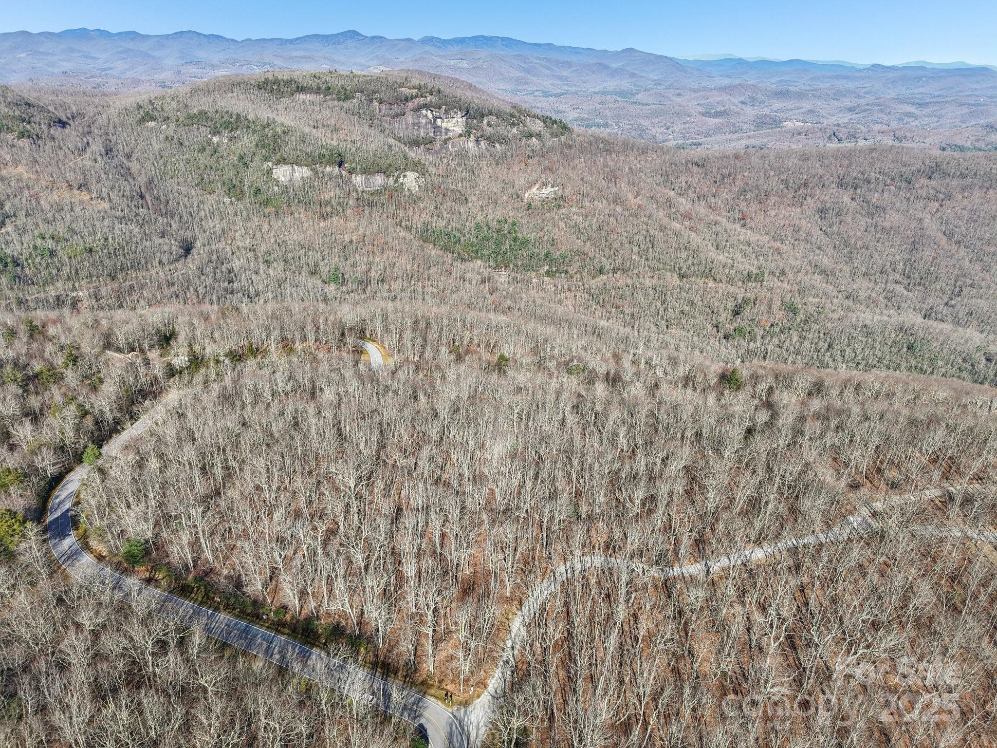 Mr-37 R Panthertown Road Lake Toxaway, NC 28747 - Photo 6 of 8 a view of a dry yard with mountains in the background