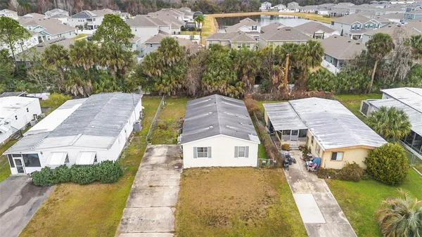 a aerial view of a house with a yard