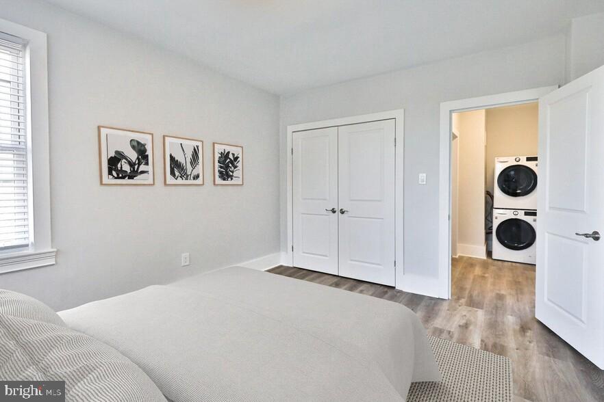 4247 Locust Street, Unit 1B503 Philadelphia, PA 19104 - Photo 27 of 38 a bedroom with a bed and a window