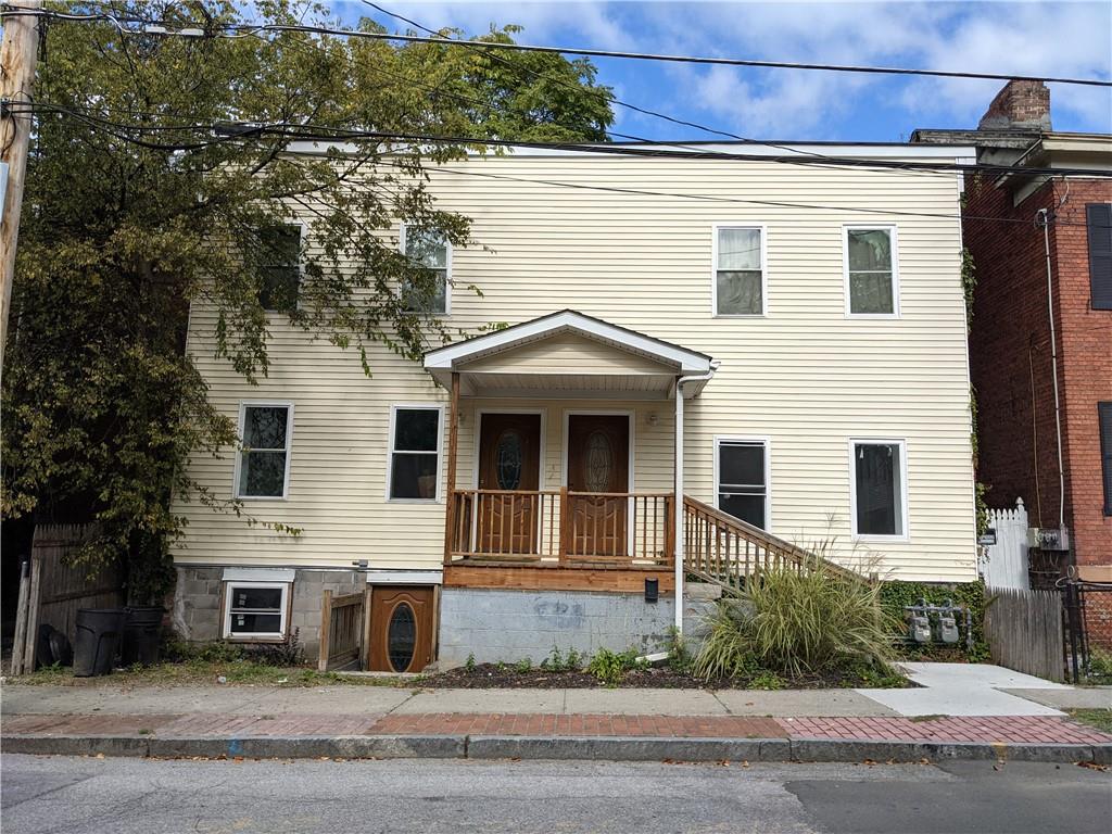 183 Mill Street Poughkeepsie, NY 12601 - Photo 1 of 1 a view of a white house with large windows and a yard