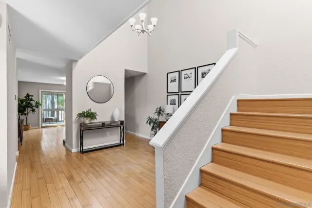 a view of dining room and hall with wooden floor