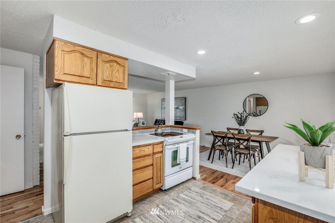 24106 4th Place West Bothell, WA 98021 - Photo 12 of 36 a kitchen with appliances and cabinets