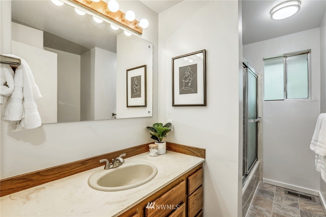 24106 4th Place West Bothell, WA 98021 - Photo 15 of 36 a bathroom with a sink and a mirror