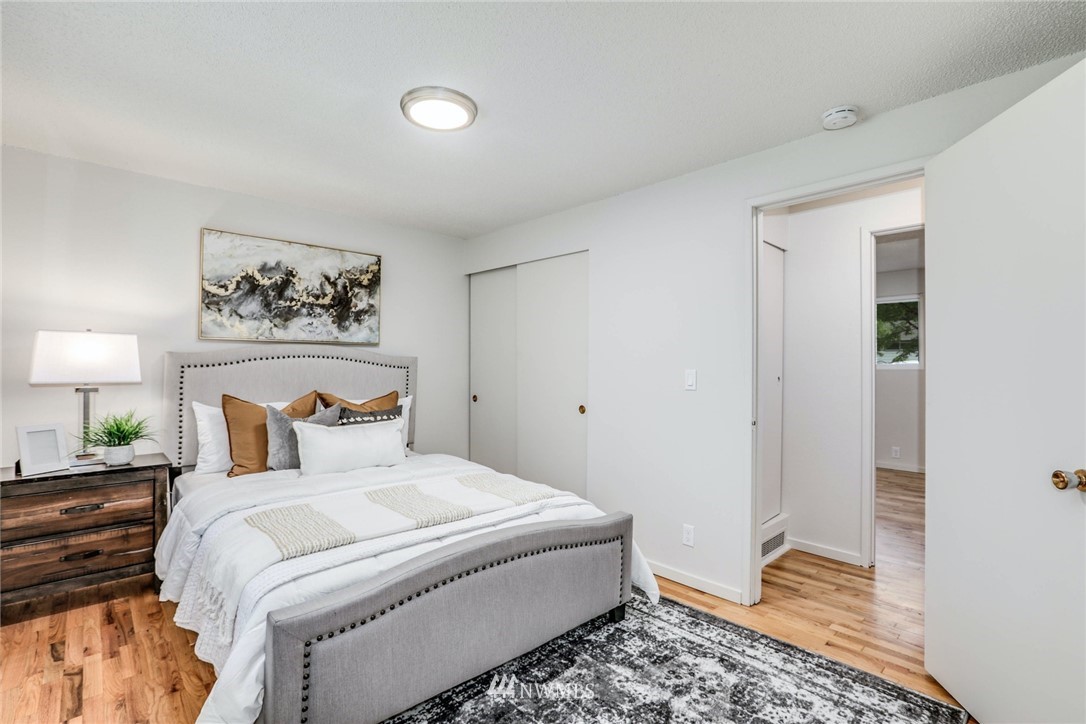 24106 4th Place West Bothell, WA 98021 - Photo 19 of 36 a bedroom with a bed and a painting on the wall