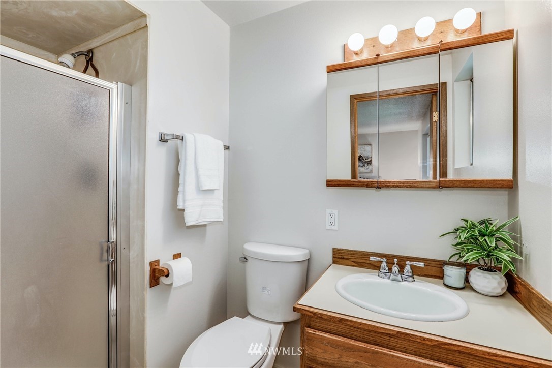 24106 4th Place West Bothell, WA 98021 - Photo 20 of 36 a bathroom with a toilet sink and mirror