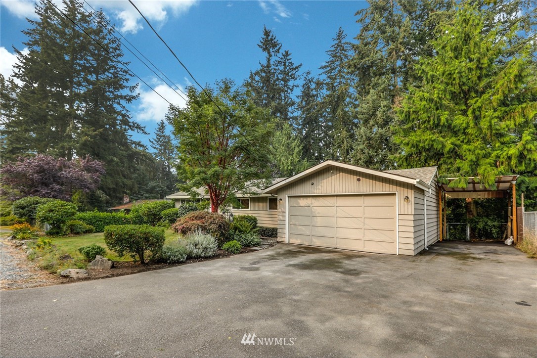 24106 4th Place West Bothell, WA 98021 - Photo 3 of 36 a front view of a house with a garden