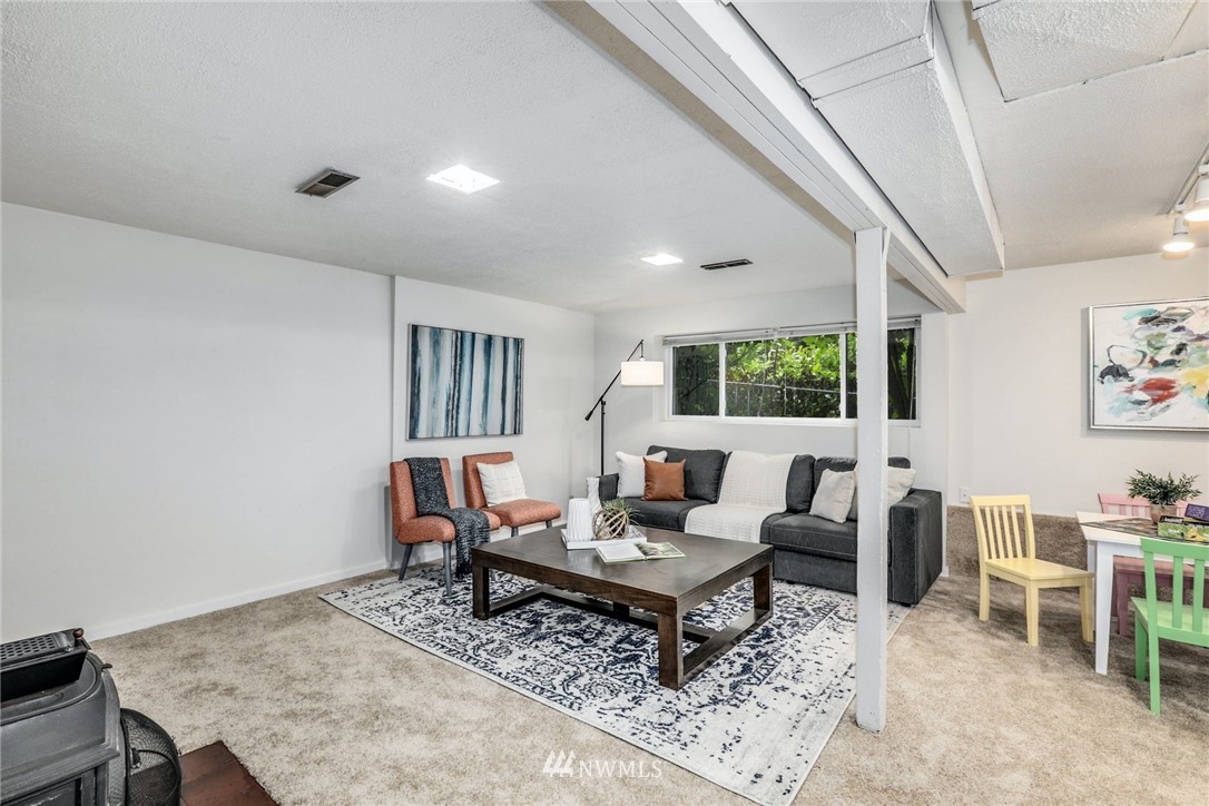 24106 4th Place West Bothell, WA 98021 - Photo 23 of 36 a living room with furniture and a rug