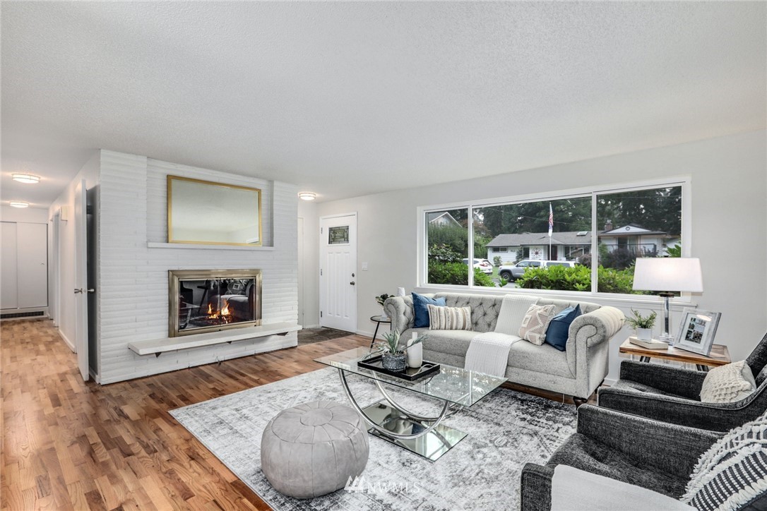 24106 4th Place West Bothell, WA 98021 - Photo 6 of 36 a living room with furniture and a fireplace