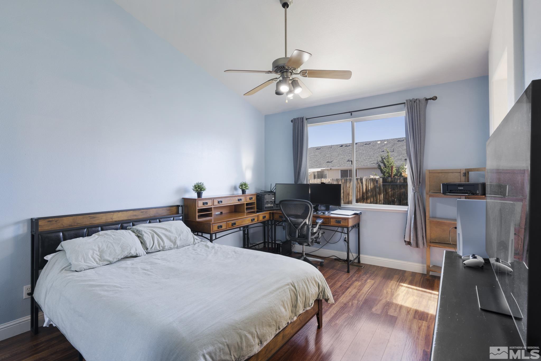 11760 Claim Stake Drive Reno, NV 89506 - Photo 13 of 22 a bed room with a bed and furniture