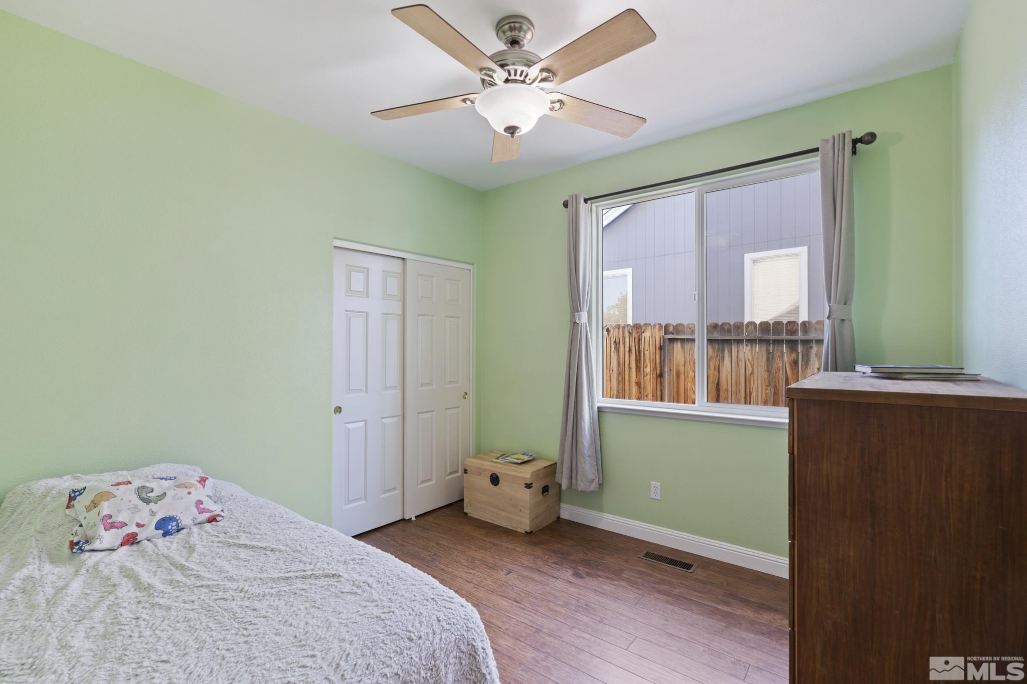 11760 Claim Stake Drive Reno, NV 89506 - Photo 16 of 22 a bedroom with a bed and a window