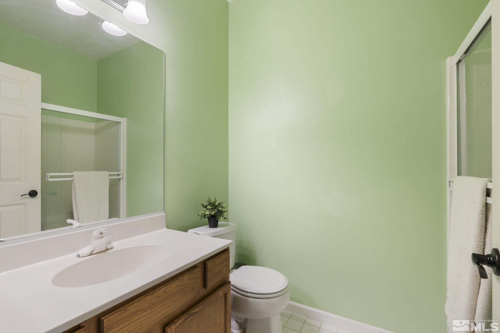 11760 Claim Stake Drive Reno, NV 89506 - Photo 17 of 22 a bathroom with a sink and a toilet