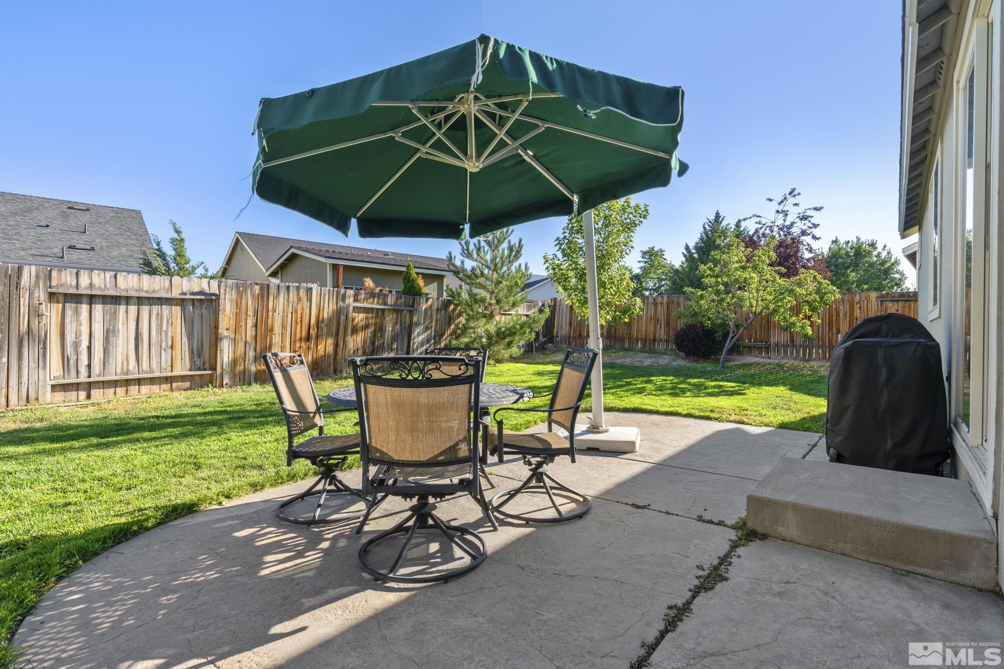 11760 Claim Stake Drive Reno, NV 89506 - Photo 19 of 22 a view of a table and chairs under an umbrella