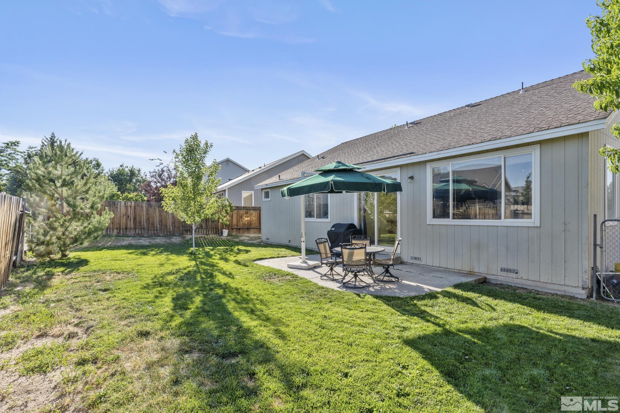 11760 Claim Stake Drive Reno, NV 89506 - Photo 20 of 22 a view of a chair and table in backyard of the house