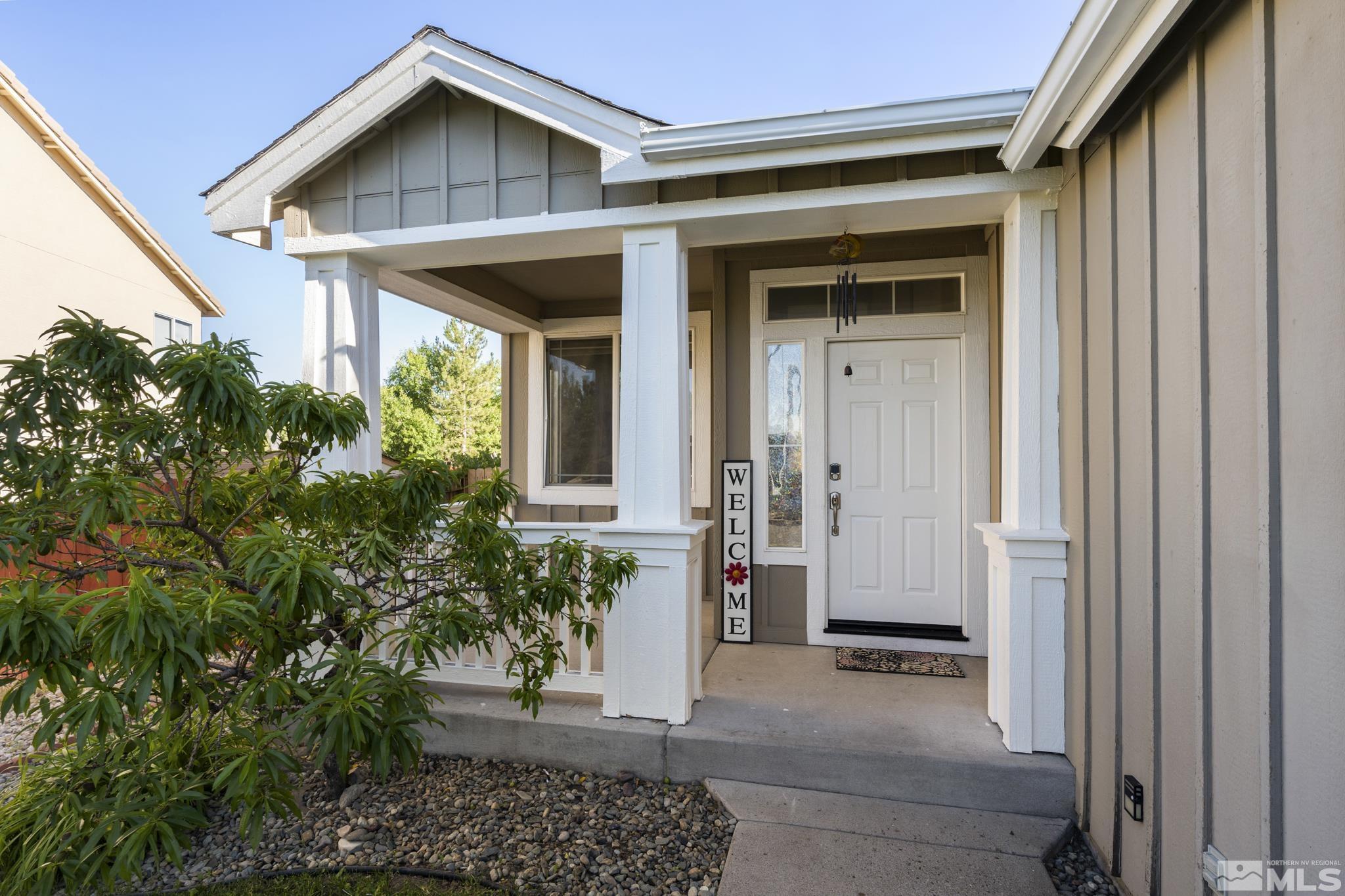 11760 Claim Stake Drive Reno, NV 89506 - Photo 2 of 22 a front view of a house with a yard
