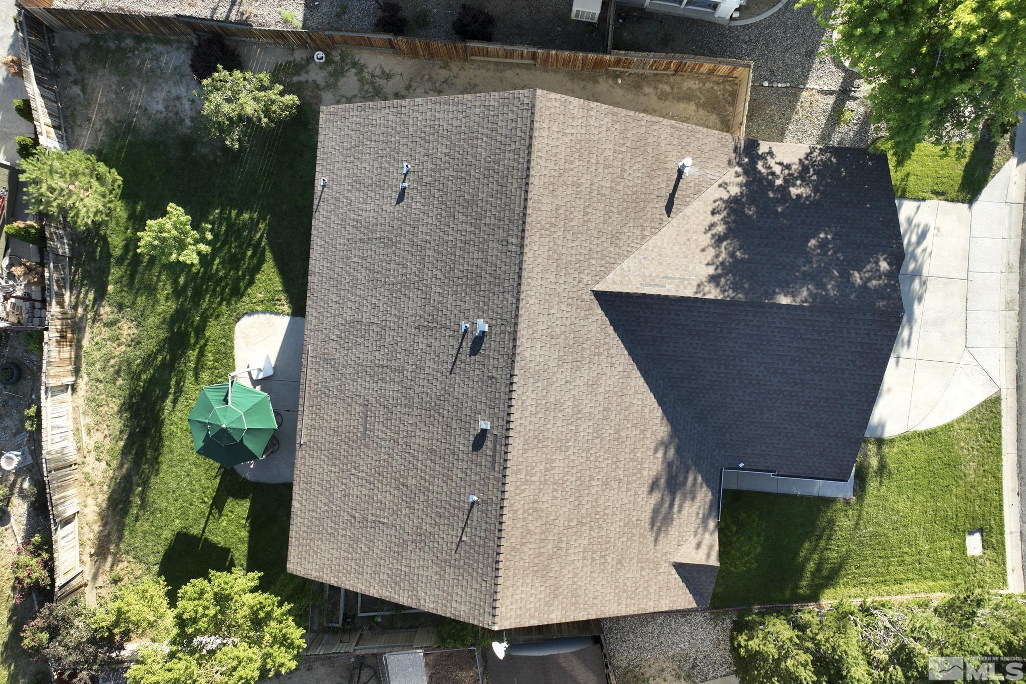 11760 Claim Stake Drive Reno, NV 89506 - Photo 22 of 22 an aerial view of a fireplace with plants and wooden floor
