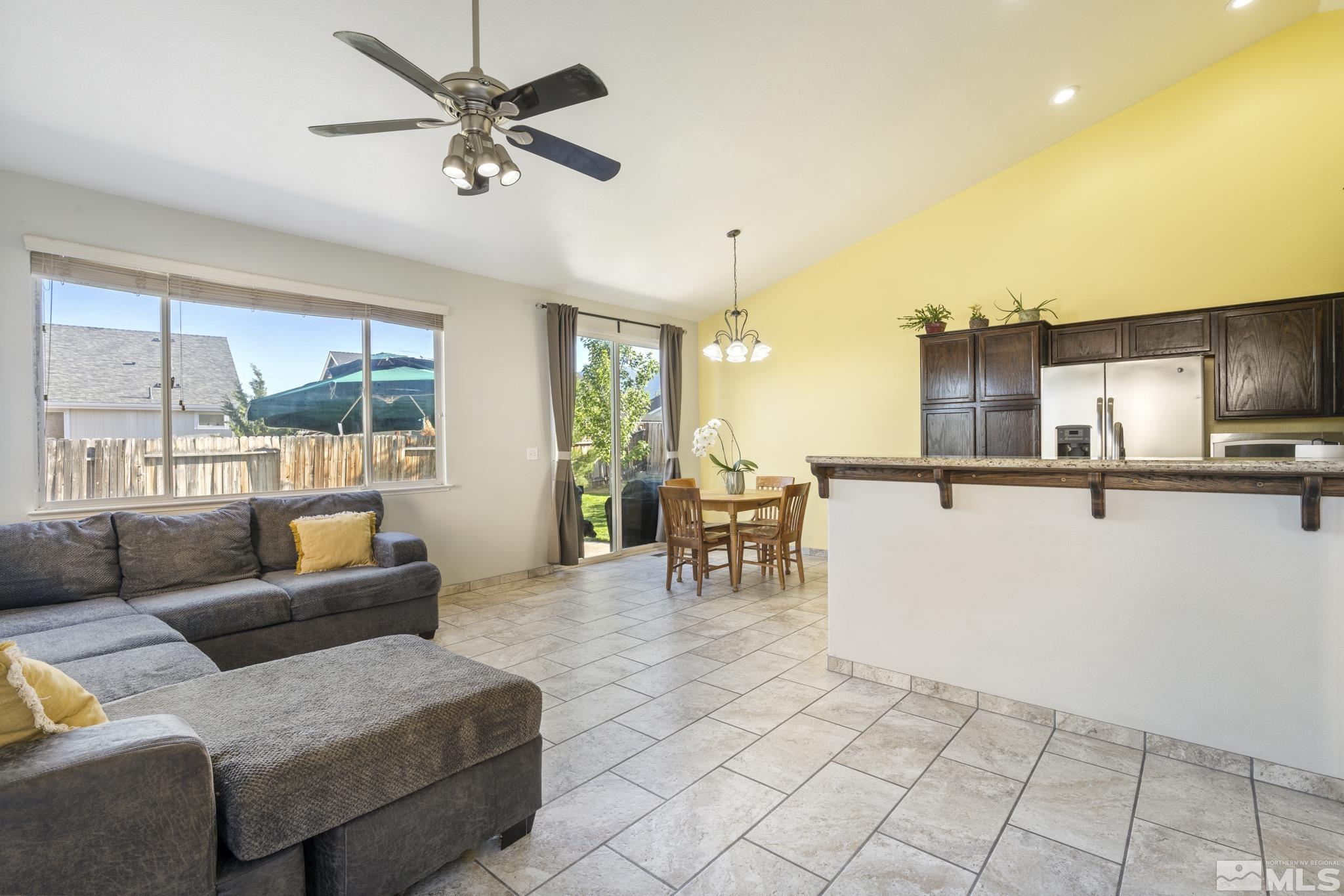 11760 Claim Stake Drive Reno, NV 89506 - Photo 8 of 22 a living room with furniture and a flat screen tv