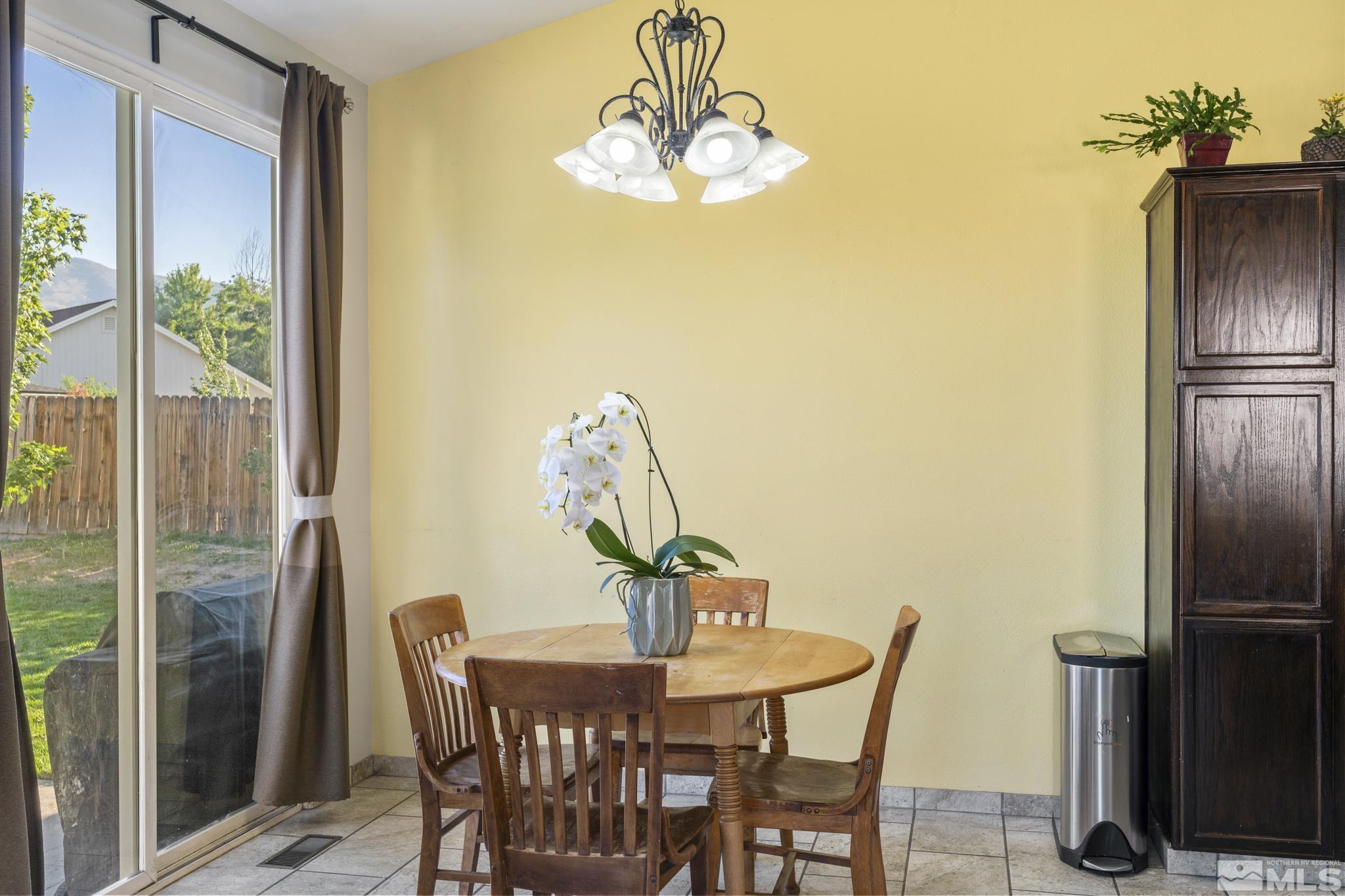11760 Claim Stake Drive Reno, NV 89506 - Photo 10 of 22 a view of a dining room with furniture window and outside view