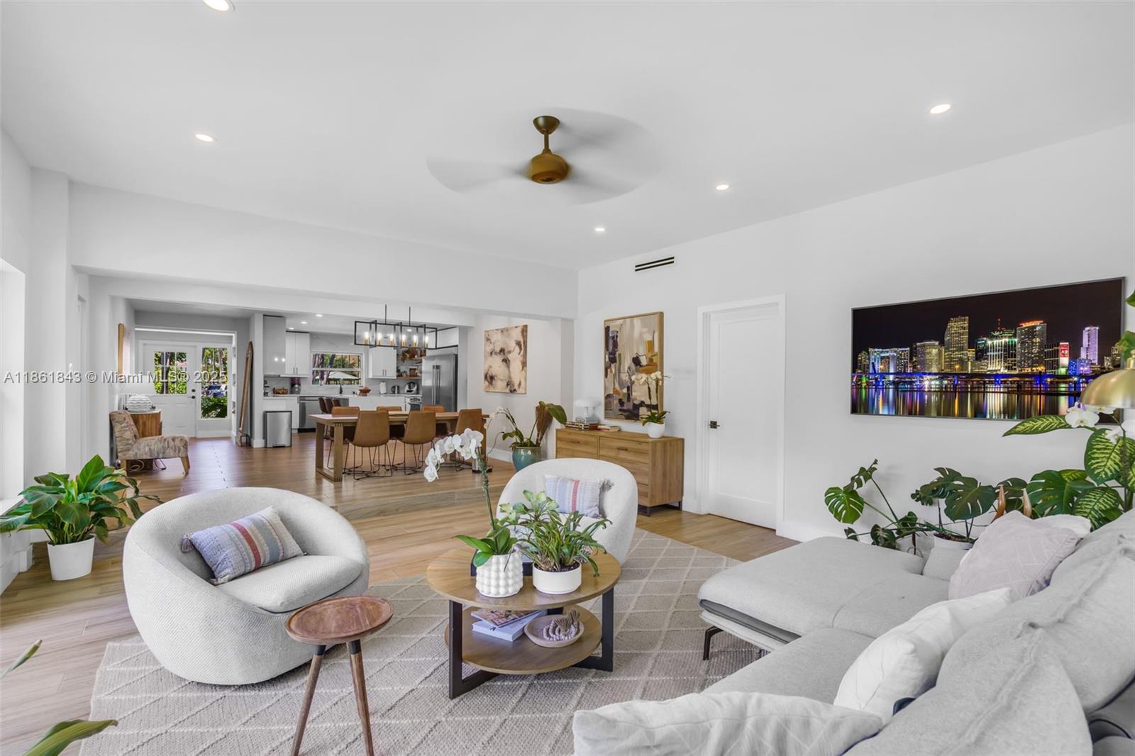 653 Glenridge Road Key Biscayne, FL 33149 - Photo 12 of 47 a living room with furniture and a flat screen tv