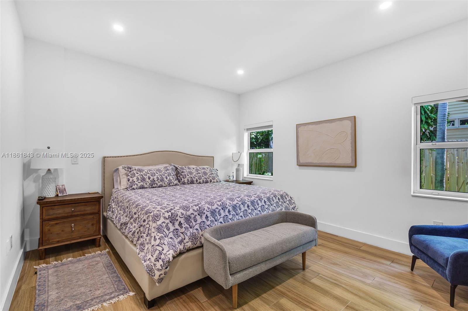 653 Glenridge Road Key Biscayne, FL 33149 - Photo 19 of 47 a bedroom with a bed and a couch