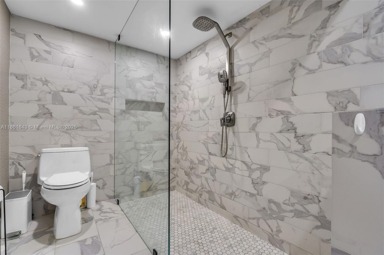 653 Glenridge Road Key Biscayne, FL 33149 - Photo 27 of 47 a bathroom with a toilet and a shower