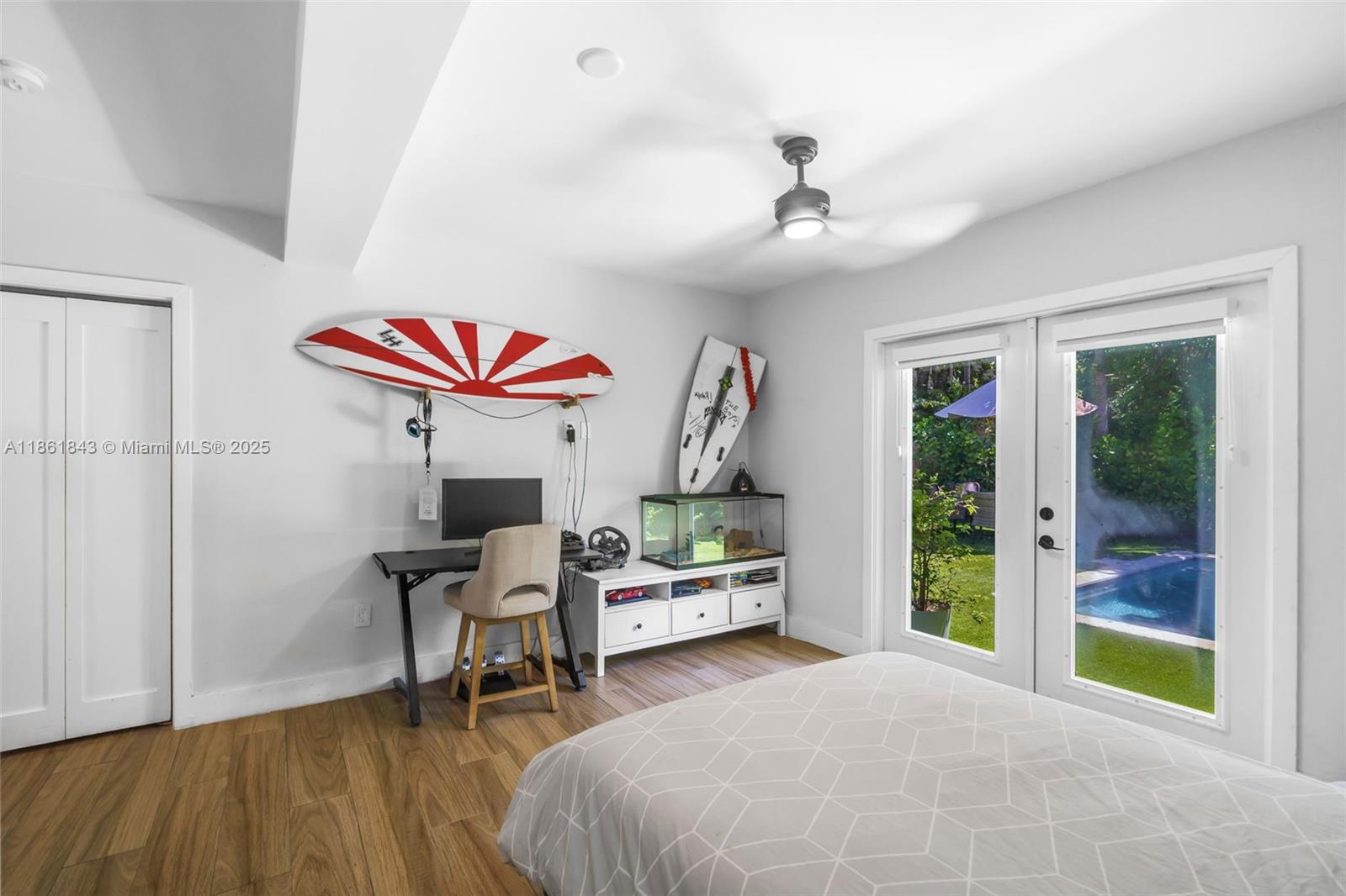 653 Glenridge Road Key Biscayne, FL 33149 - Photo 31 of 47 a bedroom with furniture and a wooden floor