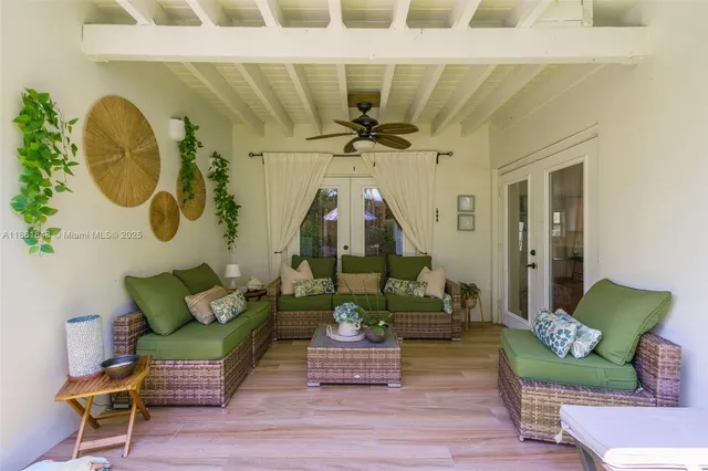 a view of a house with swimming pool and sitting area