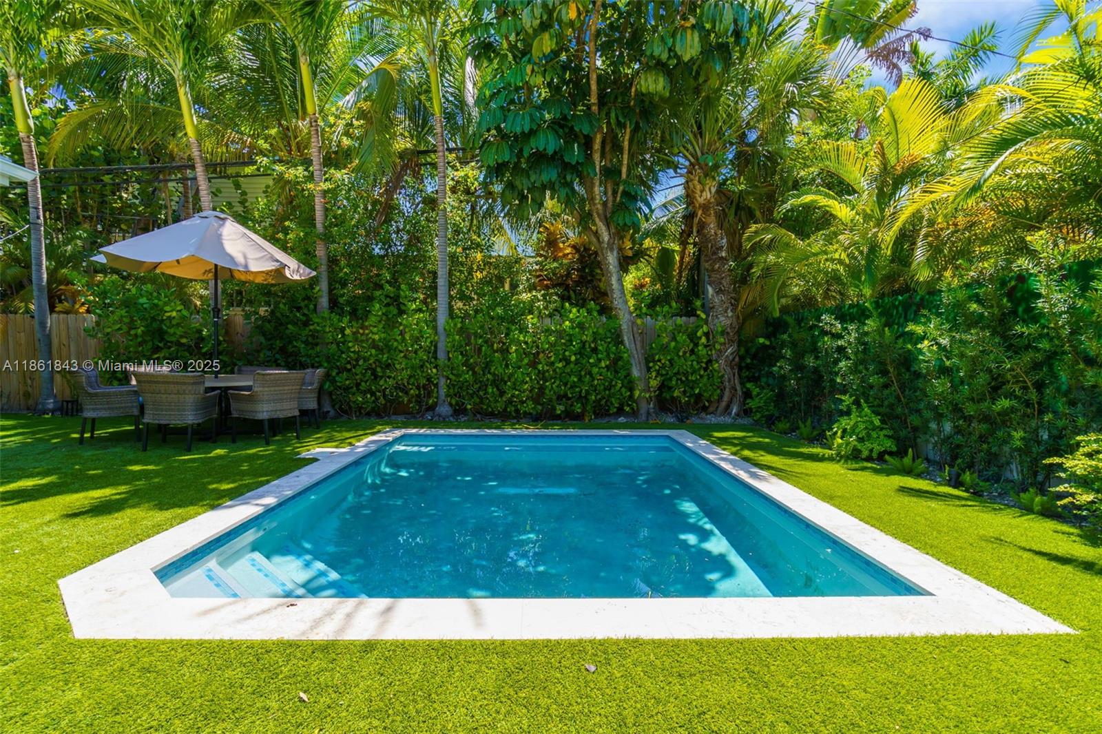 653 Glenridge Road Key Biscayne, FL 33149 - Photo 39 of 47 a view of a backyard