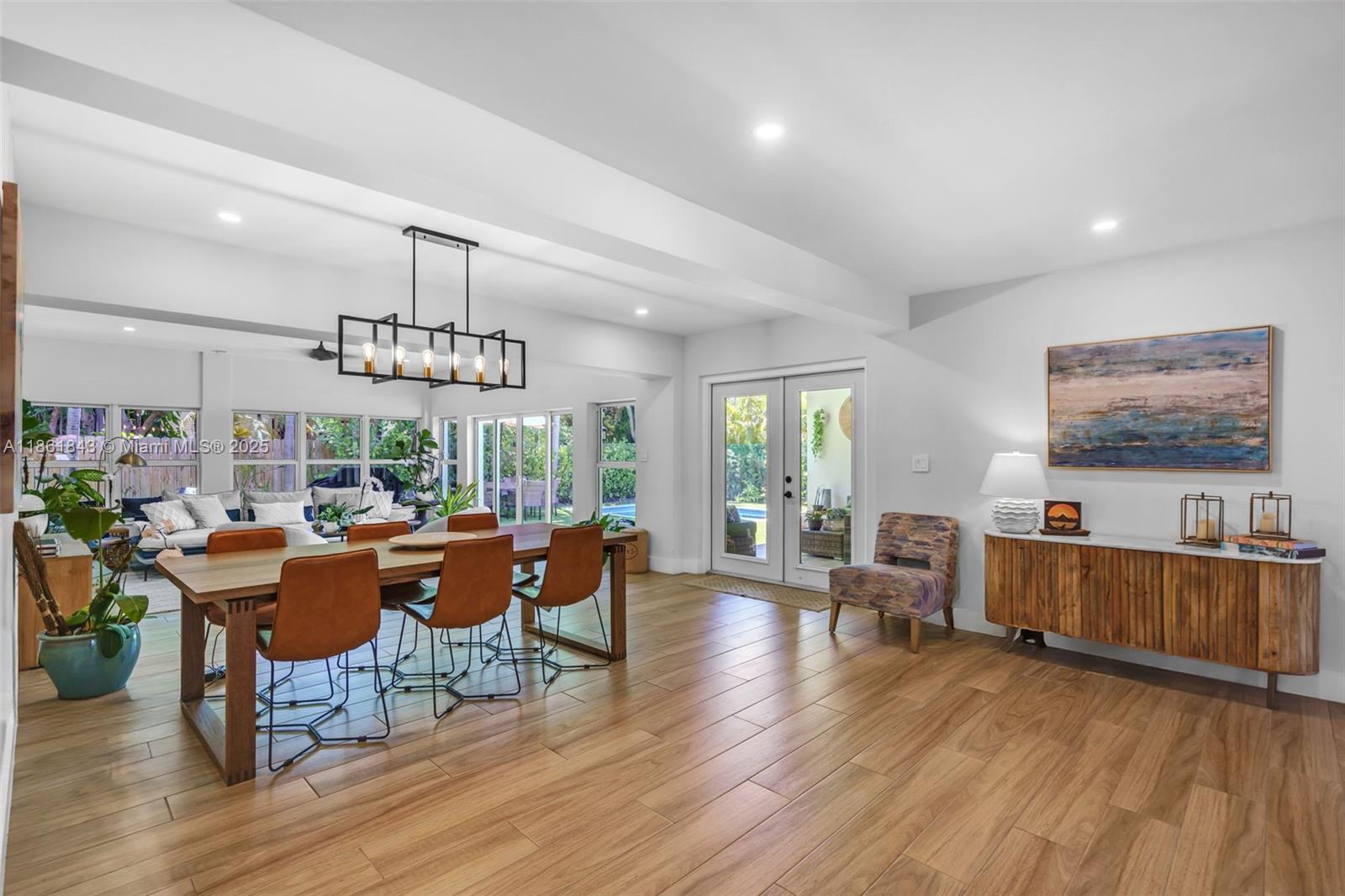 653 Glenridge Road Key Biscayne, FL 33149 - Photo 7 of 47 a living room with furniture and a wooden floor