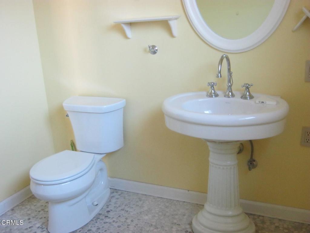 30520 Pudding Creek Road Fort Bragg, CA 95437 - Photo 11 of 24 a bathroom with a toilet sink and mirror