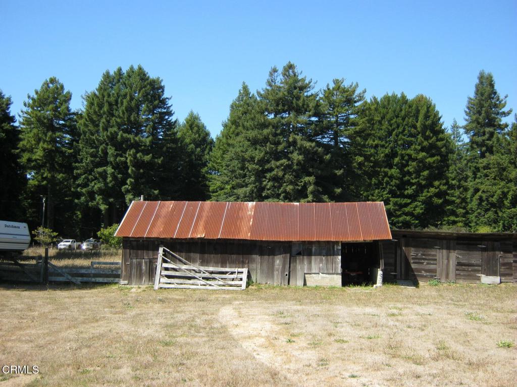 30520 Pudding Creek Road Fort Bragg, CA 95437 - Photo 14 of 24 a backyard of a house with table and chairs