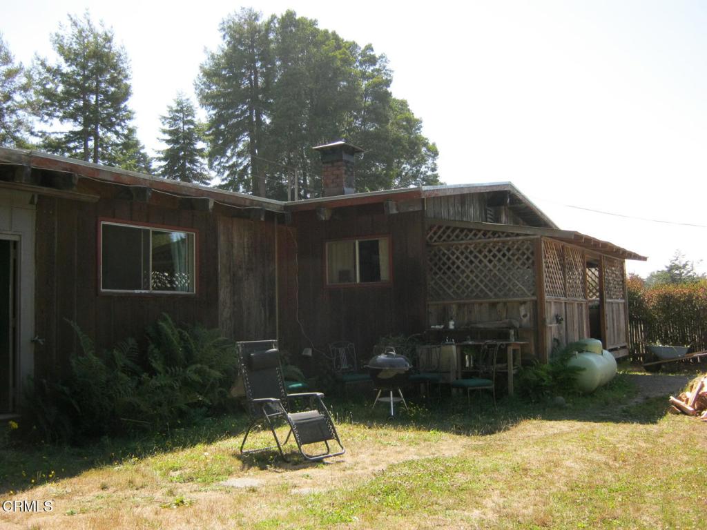 30520 Pudding Creek Road Fort Bragg, CA 95437 - Photo 2 of 24 a backyard of a house with yard fire pit and outdoor seating