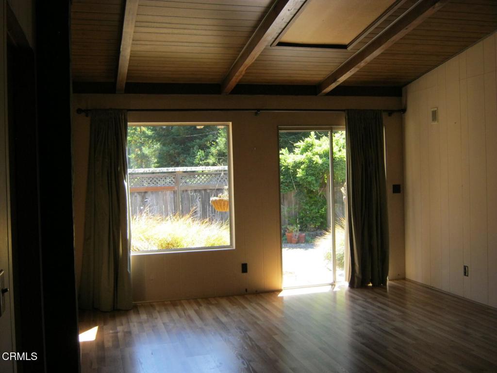 30520 Pudding Creek Road Fort Bragg, CA 95437 - Photo 6 of 24 a view of an empty room with wooden floor and a window