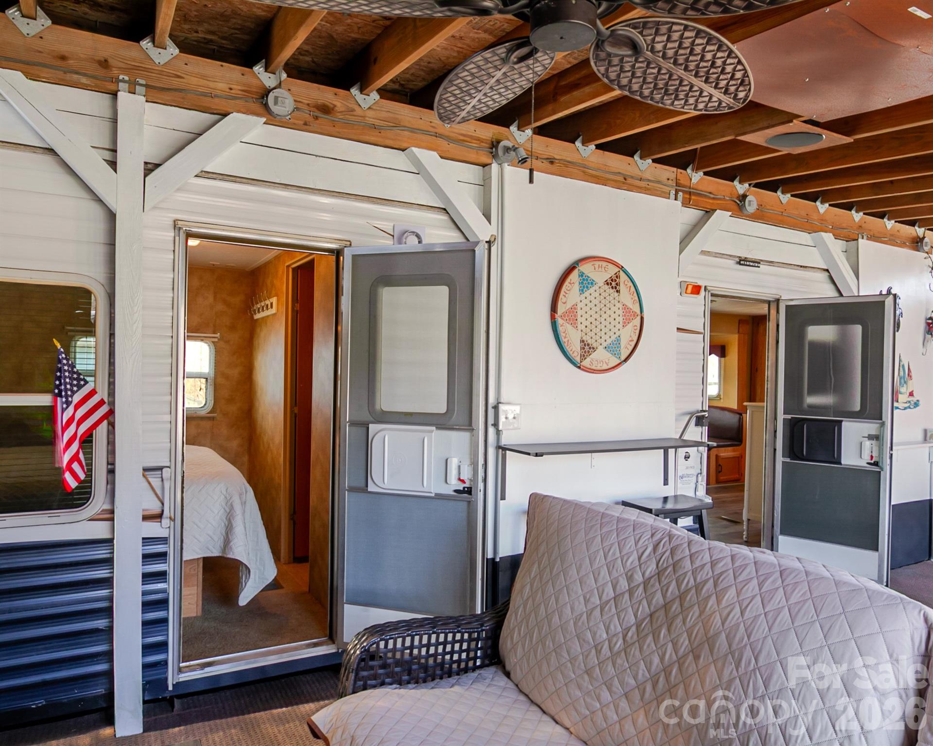 166 Badin Lake Road, Unit 757 New London, NC 28127 - Photo 13 of 45 a view of a hallway with entryway wooden floor and front door