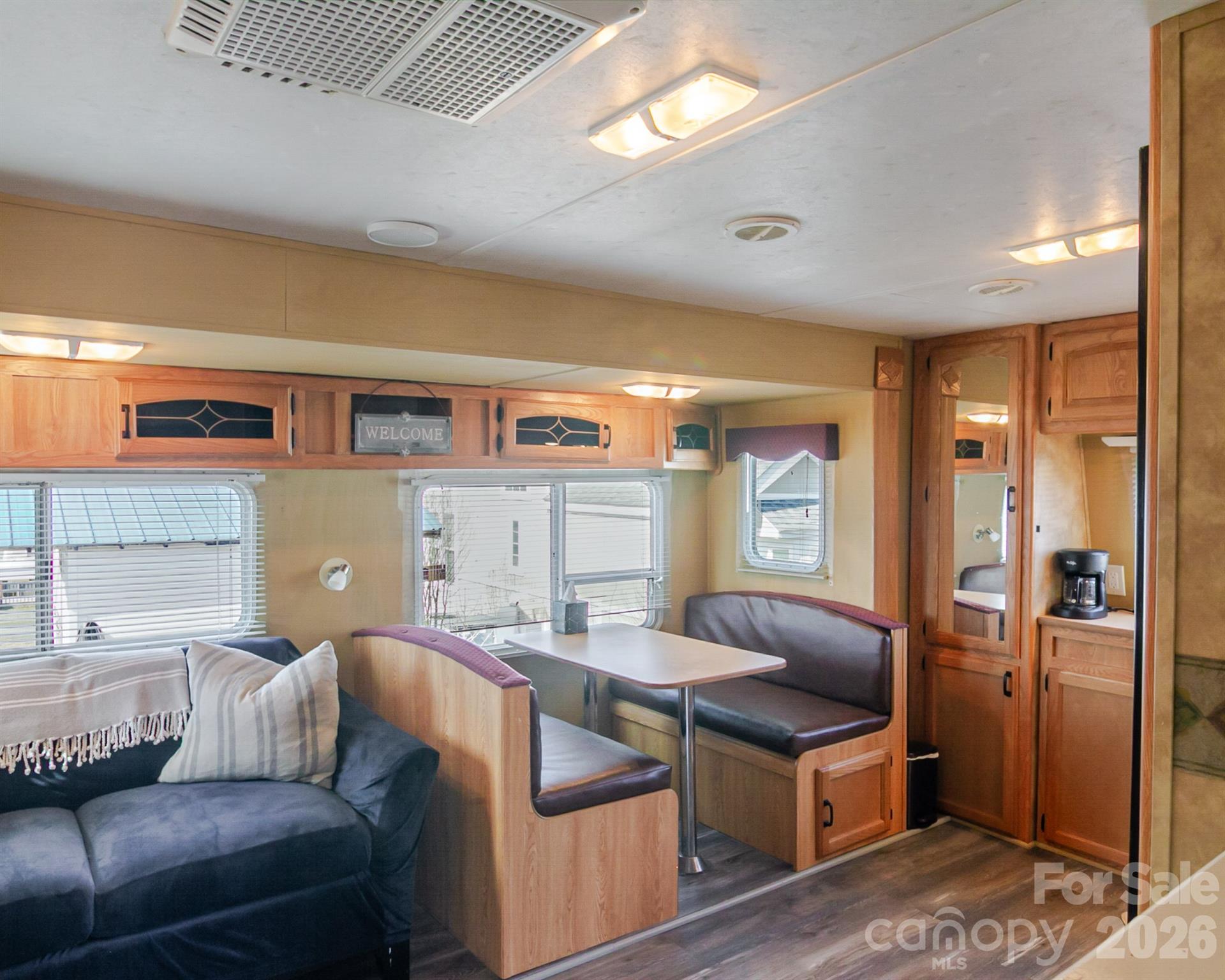 166 Badin Lake Road, Unit 757 New London, NC 28127 - Photo 14 of 45 a living room with stainless steel appliances kitchen island granite countertop furniture and a view of kitchen