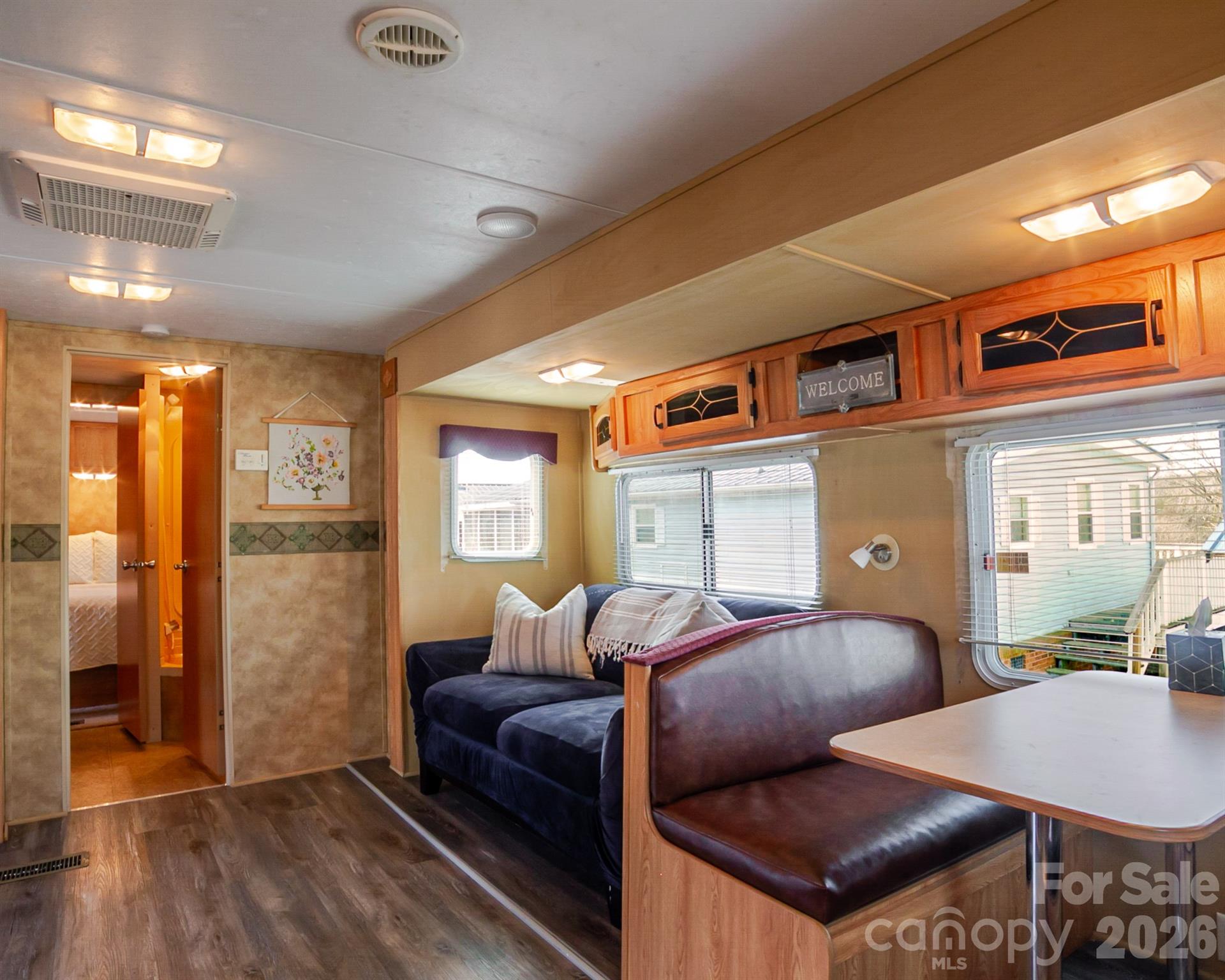 166 Badin Lake Road, Unit 757 New London, NC 28127 - Photo 19 of 45 a living room with furniture and wooden floor