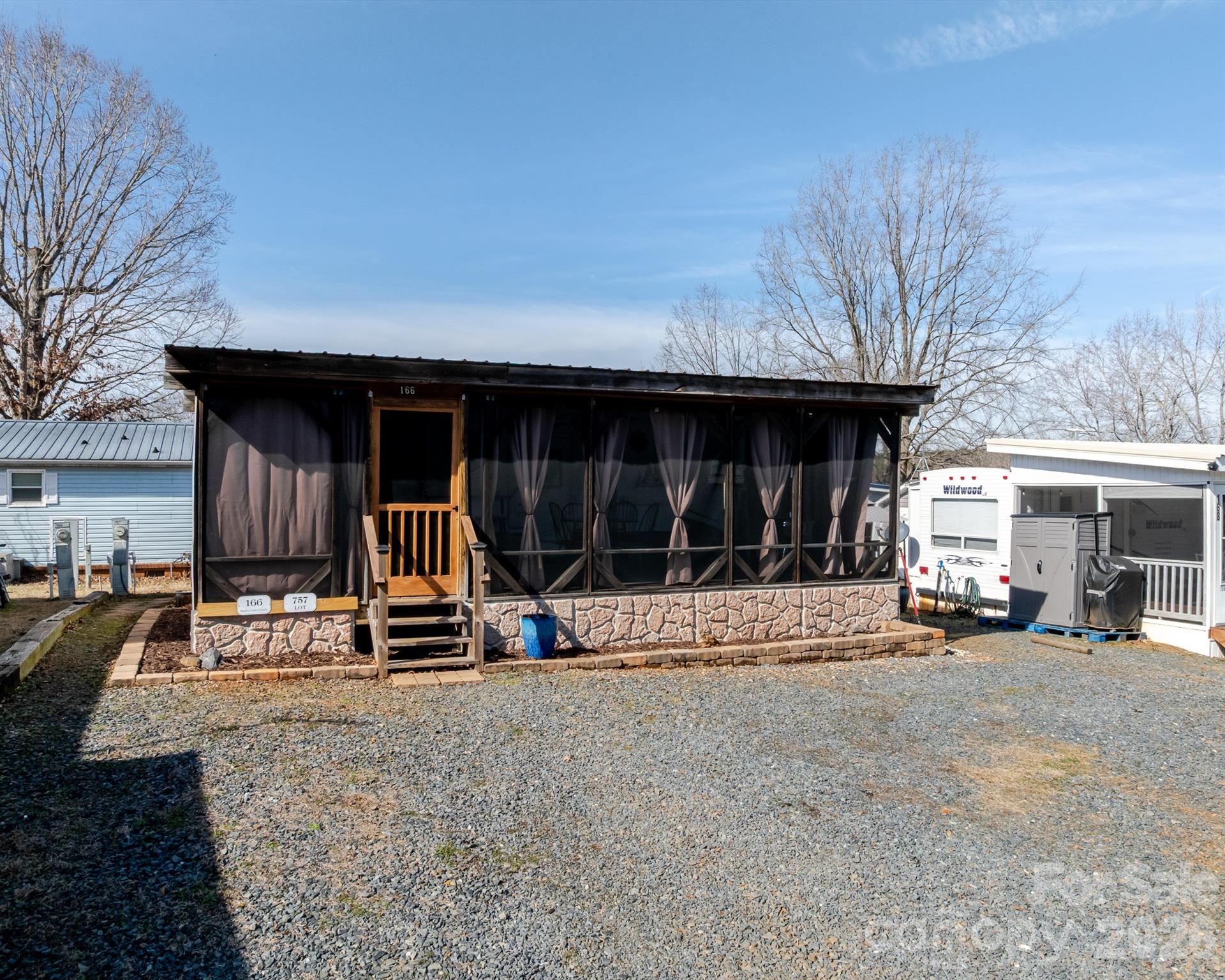 166 Badin Lake Road, Unit 757 New London, NC 28127 - Photo 2 of 45 a view of the house with outdoor space