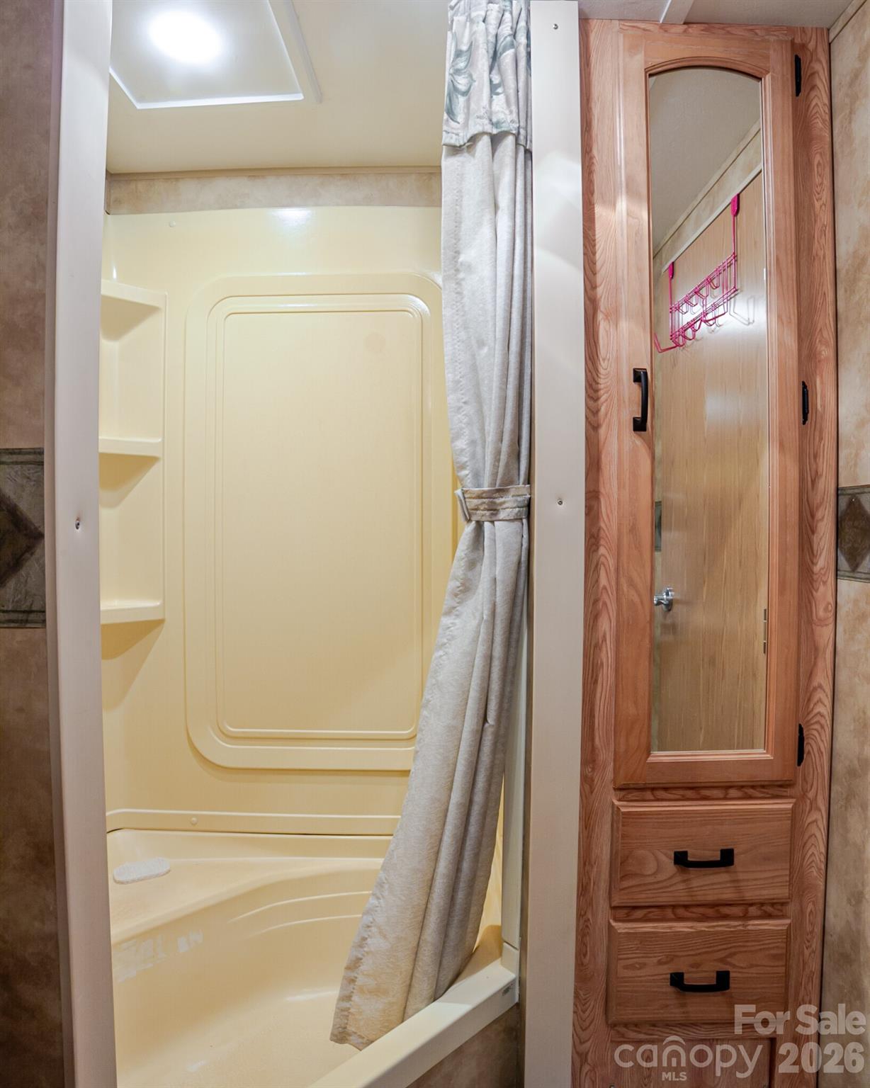 166 Badin Lake Road, Unit 757 New London, NC 28127 - Photo 22 of 45 a bathroom with a shower