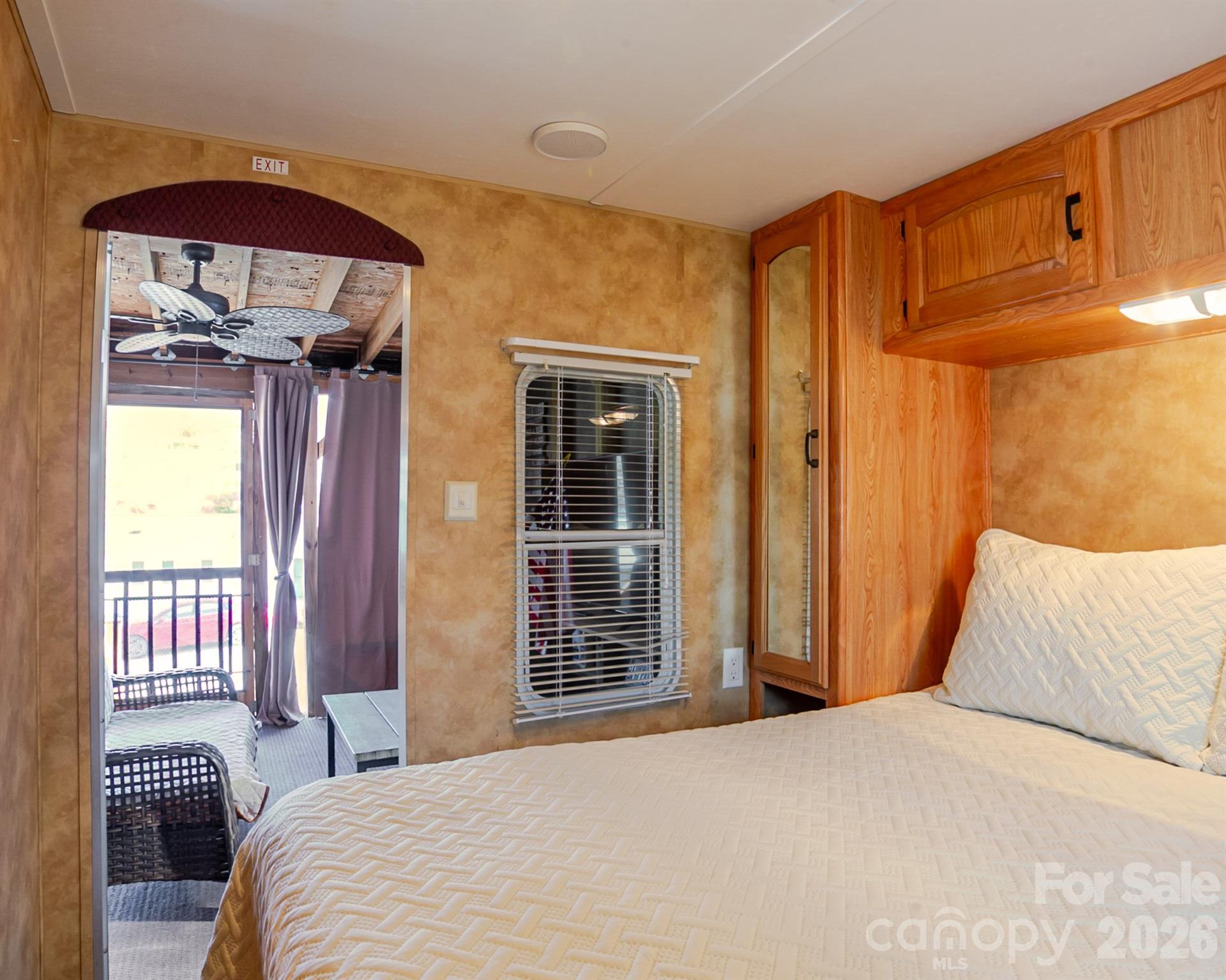 166 Badin Lake Road, Unit 757 New London, NC 28127 - Photo 24 of 45 a bedroom with a bed and wooden floor