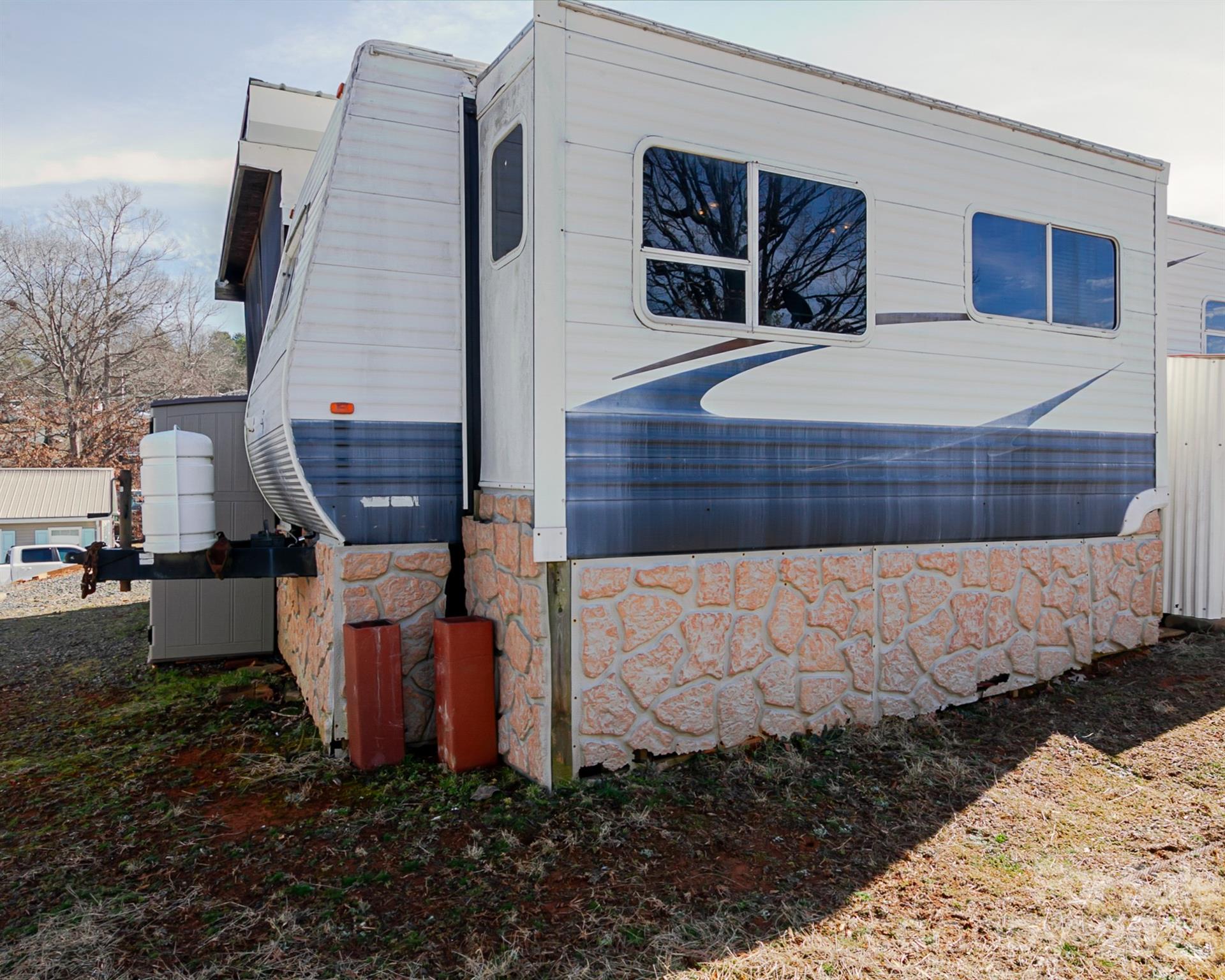 166 Badin Lake Road, Unit 757 New London, NC 28127 - Photo 29 of 45 a front view of a house with garden