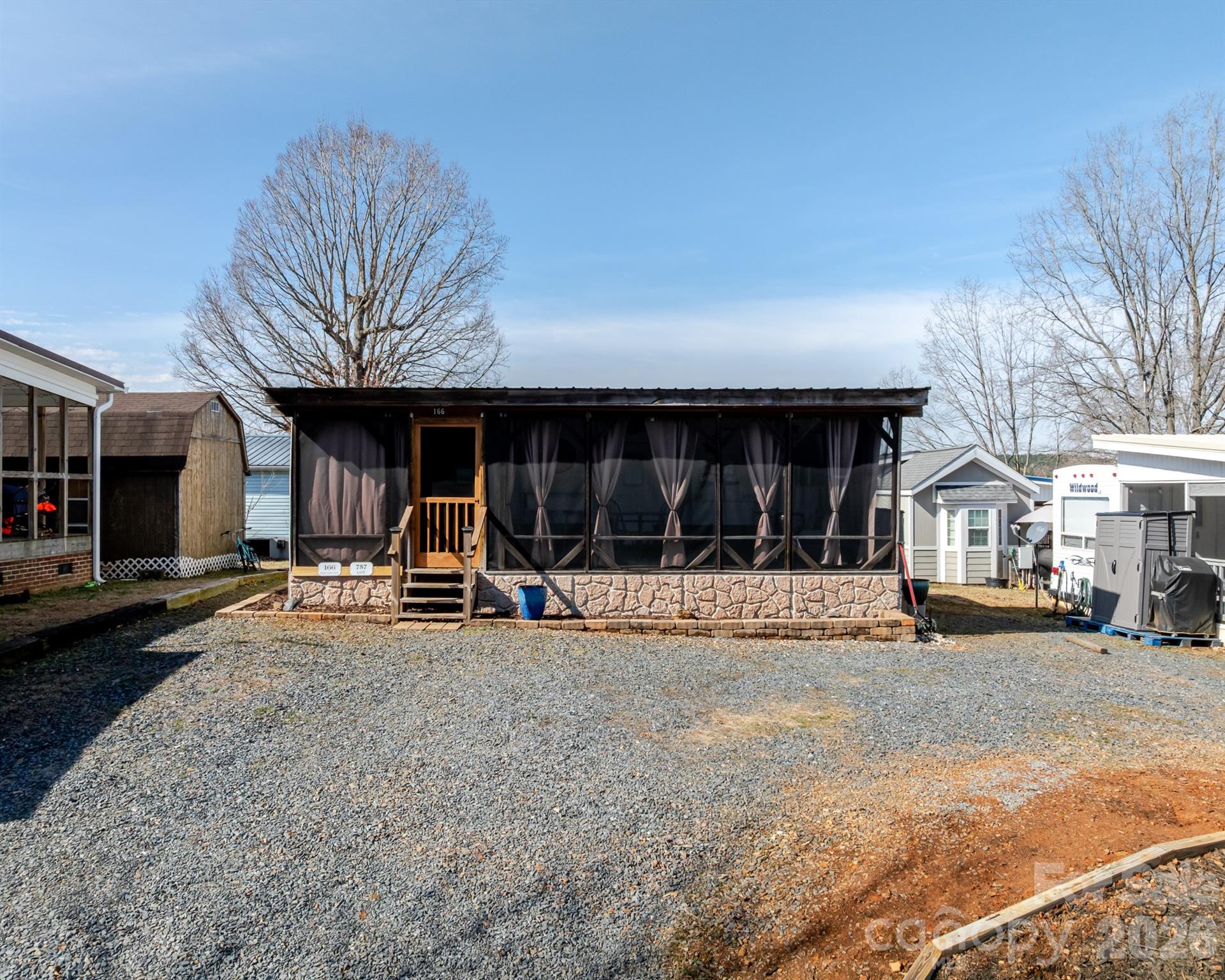 166 Badin Lake Road, Unit 757 New London, NC 28127 - Photo 3 of 45 a view of a car park in front of house