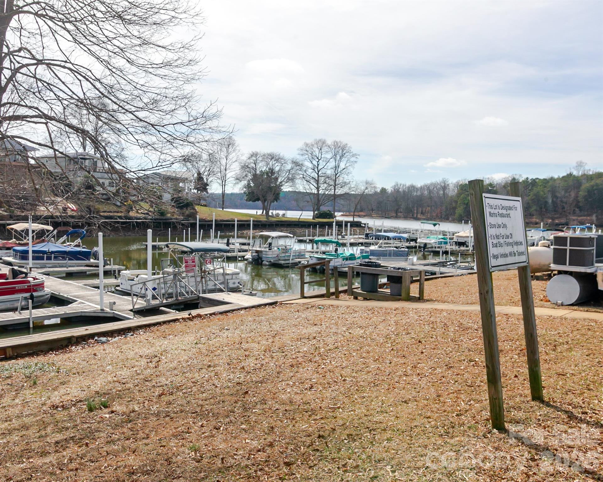 166 Badin Lake Road, Unit 757 New London, NC 28127 - Photo 32 of 45 a view of a swimming pool with a lounge chair