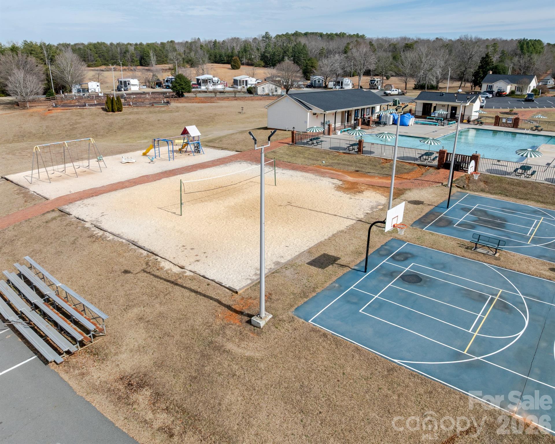 166 Badin Lake Road, Unit 757 New London, NC 28127 - Photo 40 of 45 a view of a swimming pool with lounge chairs