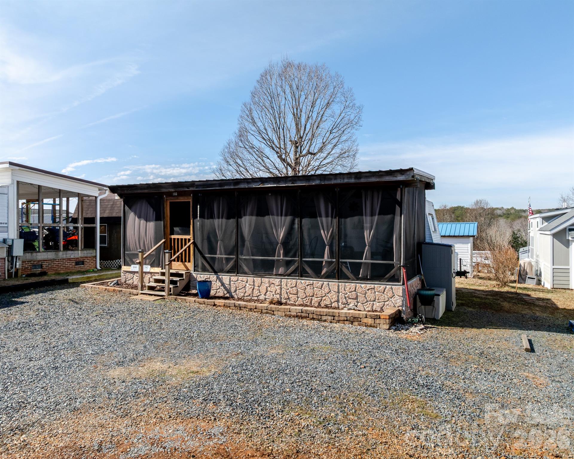 166 Badin Lake Road, Unit 757 New London, NC 28127 - Photo 4 of 45 a view of a house with backyard