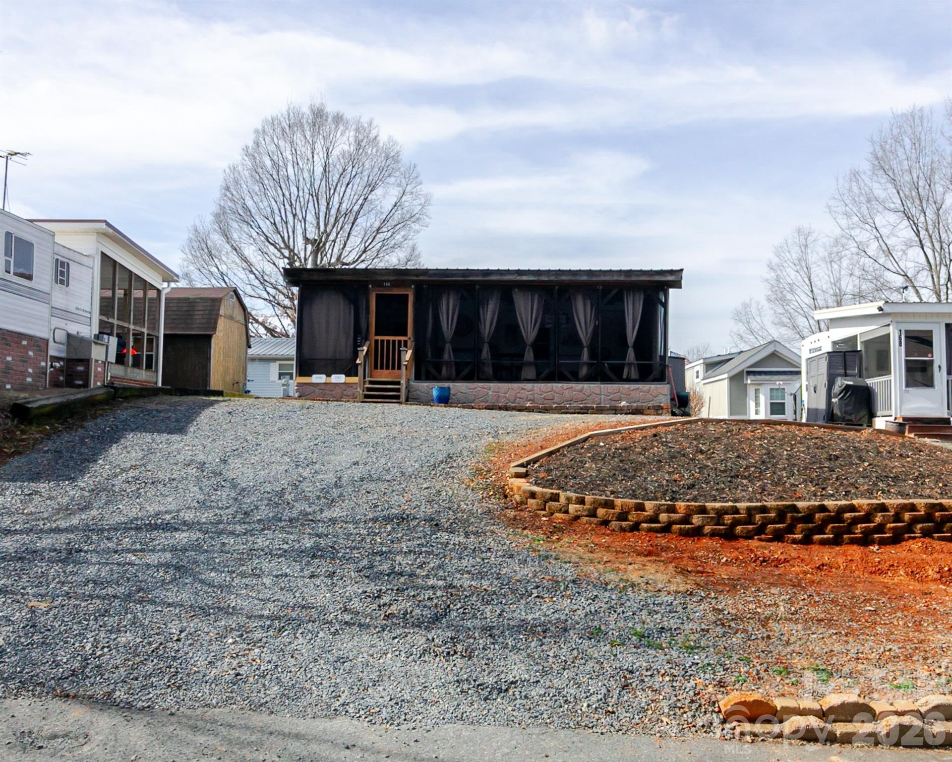 166 Badin Lake Road, Unit 757 New London, NC 28127 - Photo 6 of 45 a front view of a house with a yard