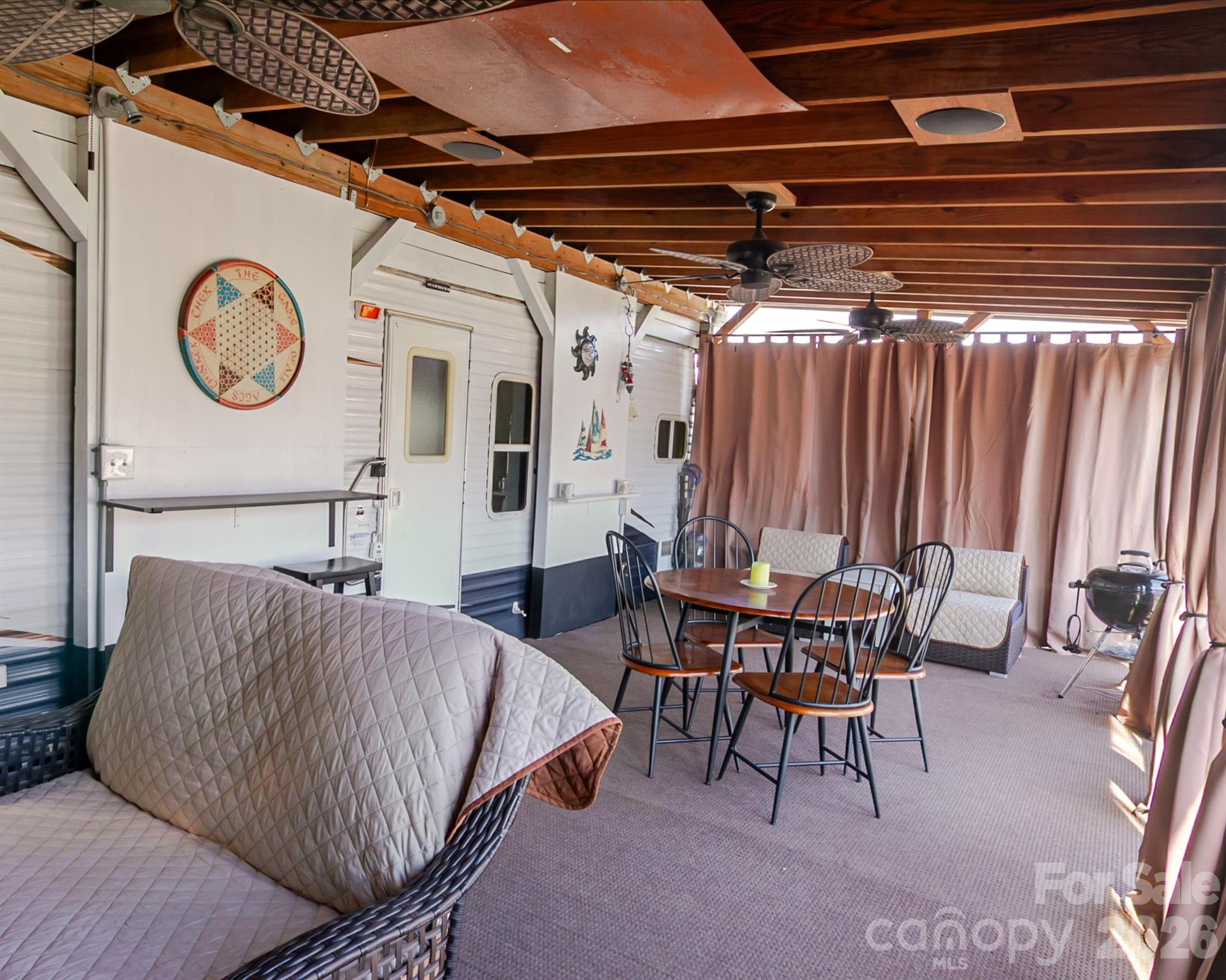 166 Badin Lake Road, Unit 757 New London, NC 28127 - Photo 8 of 45 a bedroom with furniture and a large window