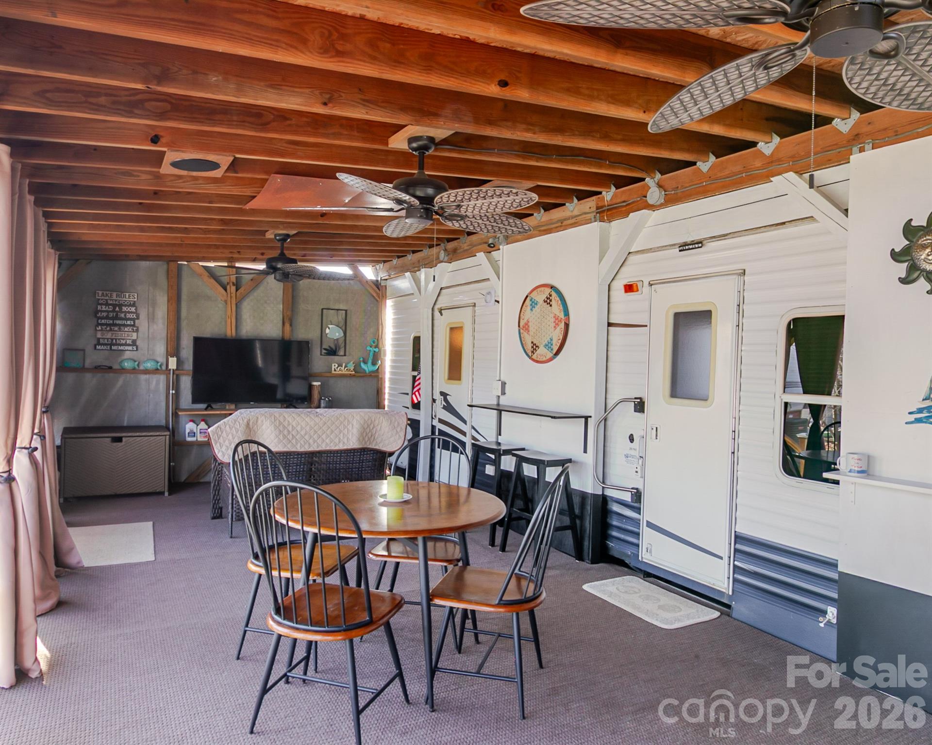 166 Badin Lake Road, Unit 757 New London, NC 28127 - Photo 10 of 45 a view of a chairs and table in a room