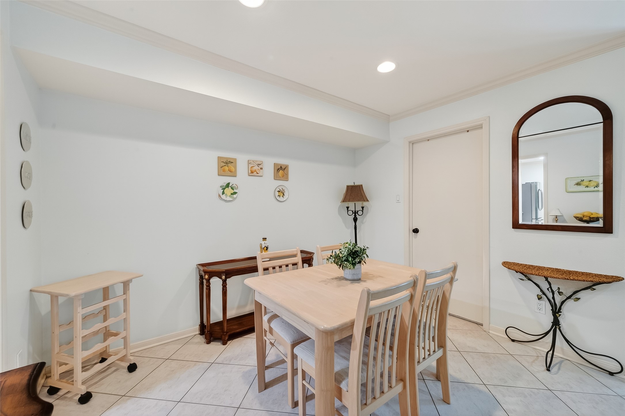 14690 Perthshire Road, Unit C Houston, TX 77079 - Photo 20 of 48 Positioned beside the kitchen and open to the living area, this cheerful dining space facilitates effortless movement between the main zones.