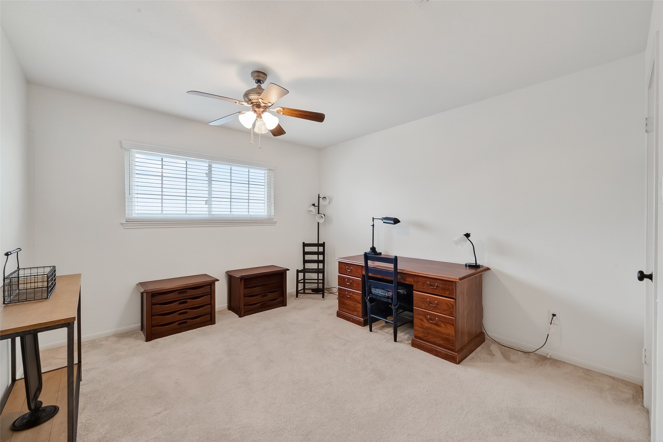 14690 Perthshire Road, Unit C Houston, TX 77079 - Photo 31 of 48 Soft carpeting and creamy neutrals create a peaceful environment in this room, perfectly suited for a focused home office or private study.