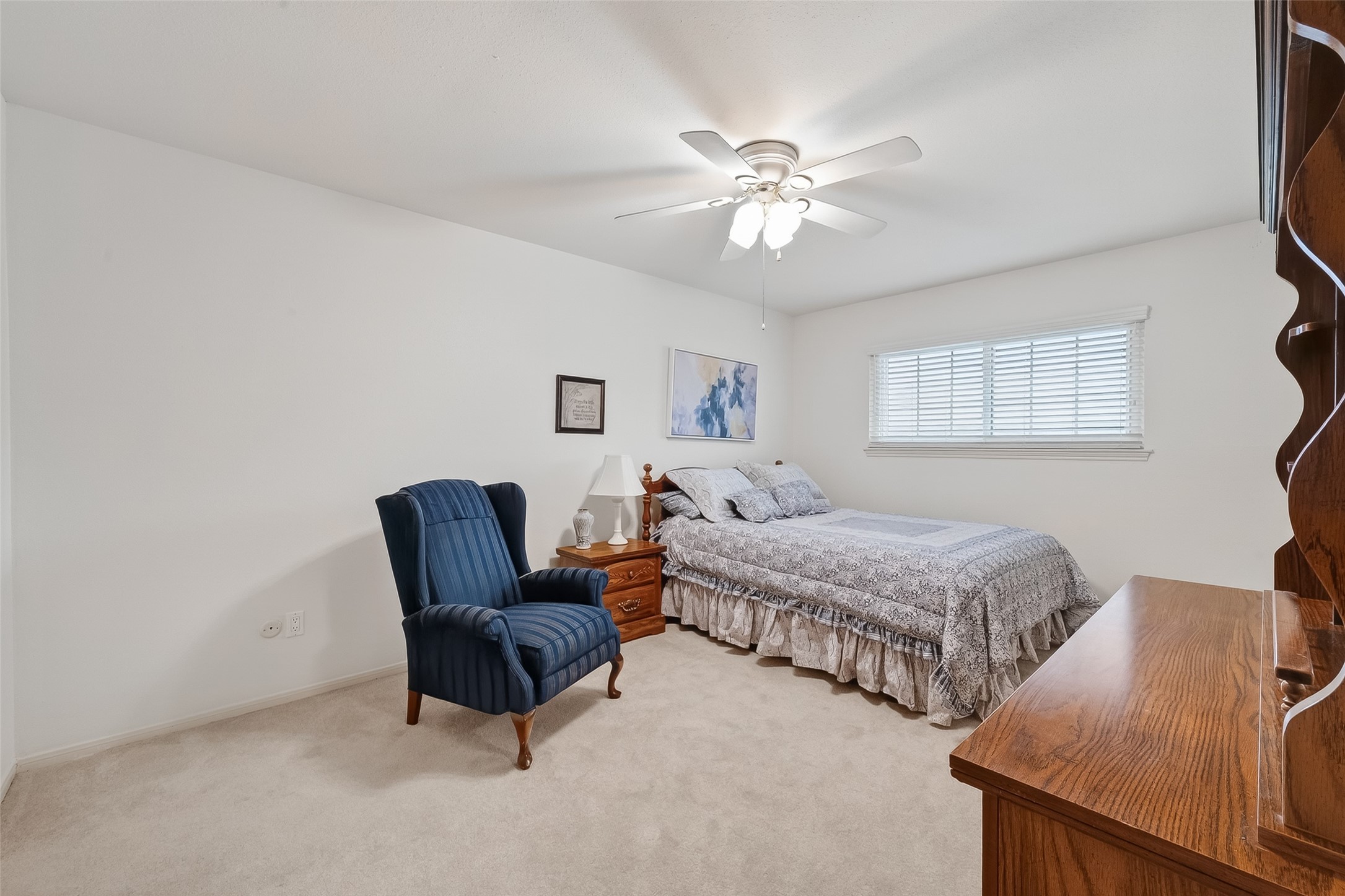 14690 Perthshire Road, Unit C Houston, TX 77079 - Photo 33 of 48 A secondary bedroom that prioritizes comfort with a generous footprint, a wide window, and a steady breeze from the ceiling fan.