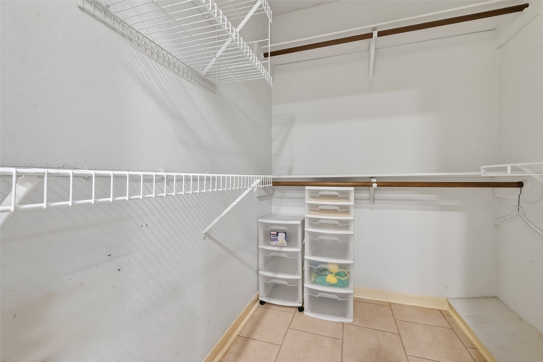 14690 Perthshire Road, Unit C Houston, TX 77079 - Photo 44 of 48 This storage suite features a robust system of racks, shelves, and rods to house a voluminous collection.